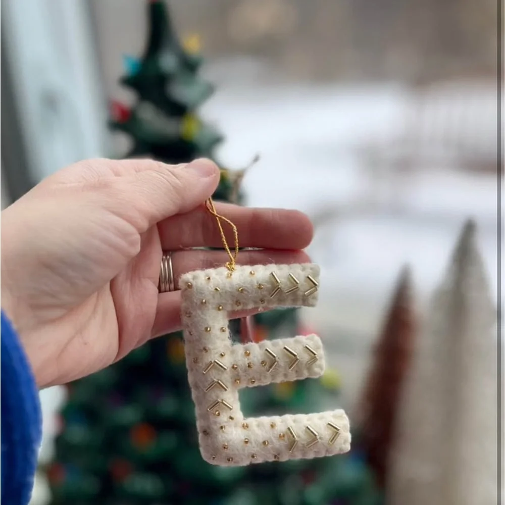 ONE * West Elm Handcrafted Wool Cream Holiday Ornament Message for which Letter